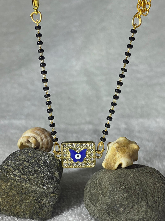 A Mangal Sutra With Evil Eyes Design  On Butterfly Bracelet Full Of Wibe